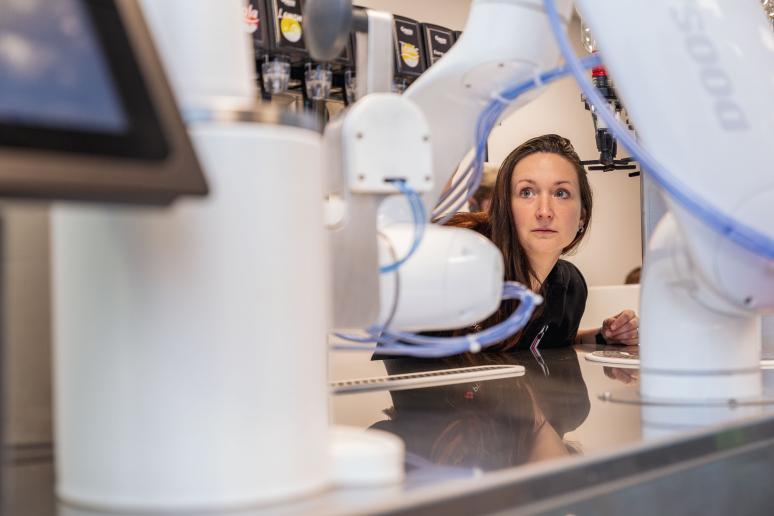 Woman watches robot installation